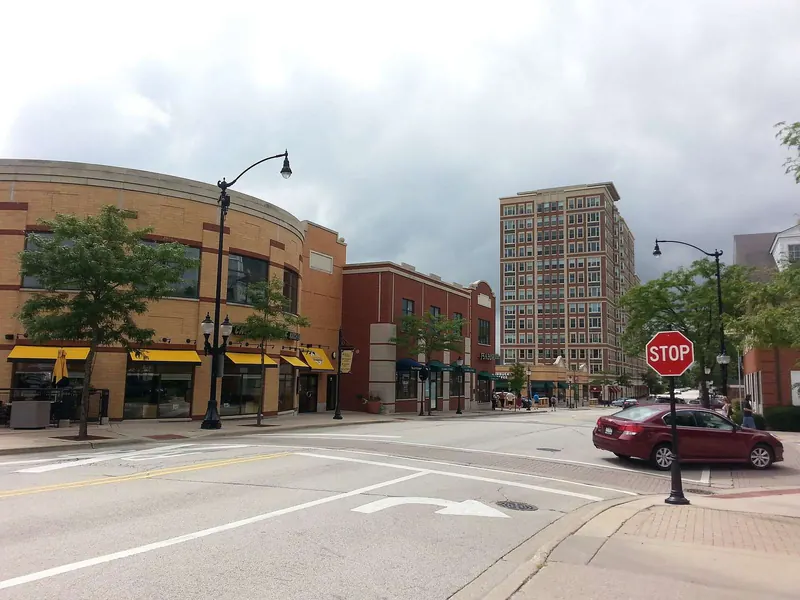 Downtown Arlington Heights, Illinois, with local shops and a pedestrian crossing